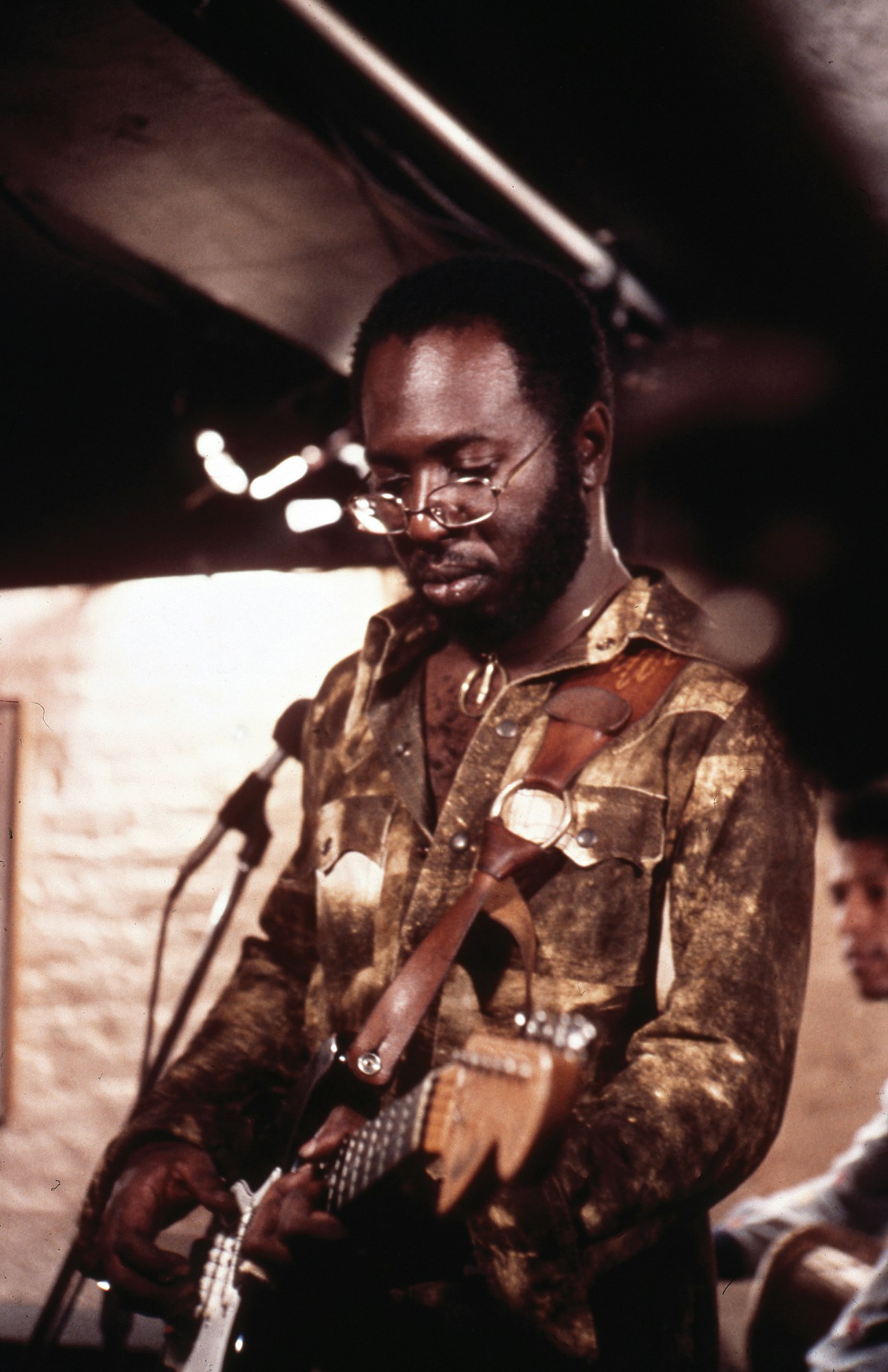 Curtis Mayfield performs “Pusherman” in the film Super Fly, 1972. Photo via Cache Agency.